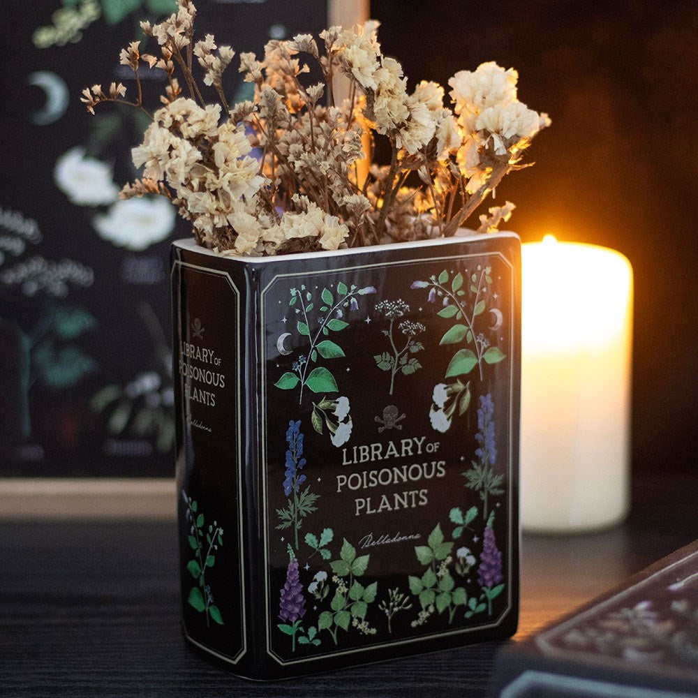 "Library of Poisonous Plants" Book-Shaped Ceramic Vase Gothic Botanical Decor – styled setting